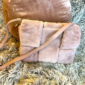 Adorable fuzzy clutch/crossbody bag from Anthropologie. Removable strap.
